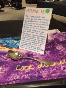 A silver serving spoon used by 3 generations of women in her family says "Home" to this DC resident. On her hand-written label the green dot means visitors can handle the object. 